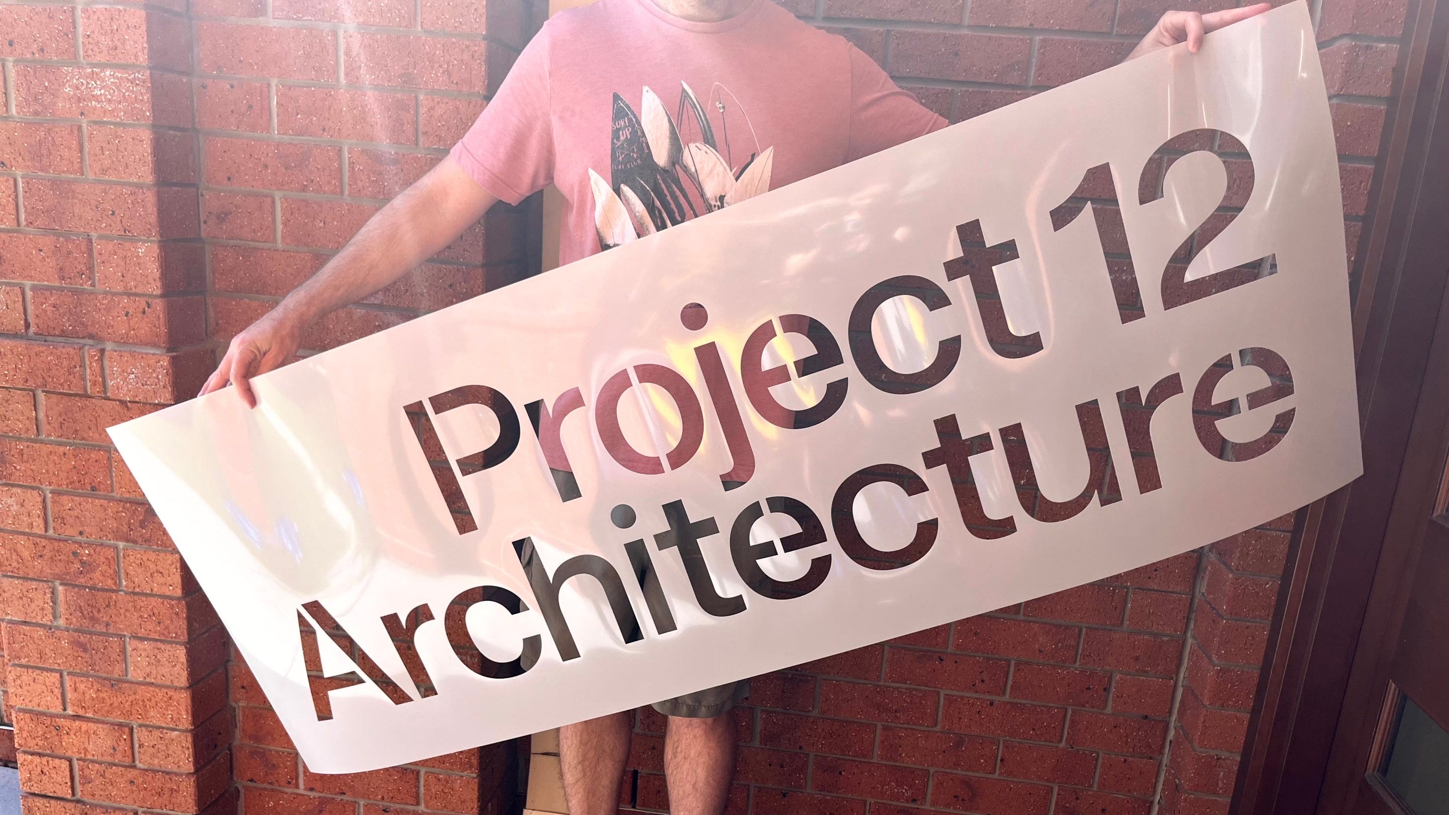 Durable reusable Mylar stencil for Project 12 Architecture, ideal for architectural branding, concrete marking, or office signa