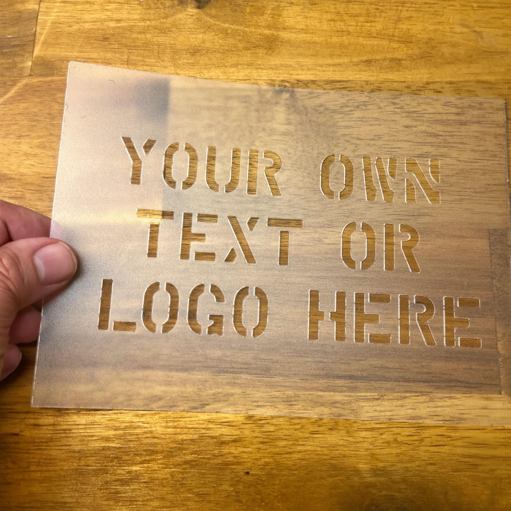 Custom laser-cut mylar stencil sheet.